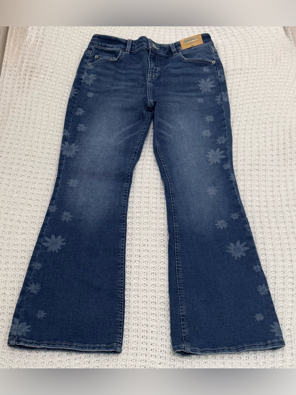 Thereabouts girls mid rise fitted through waist hip and thigh flare at leg.